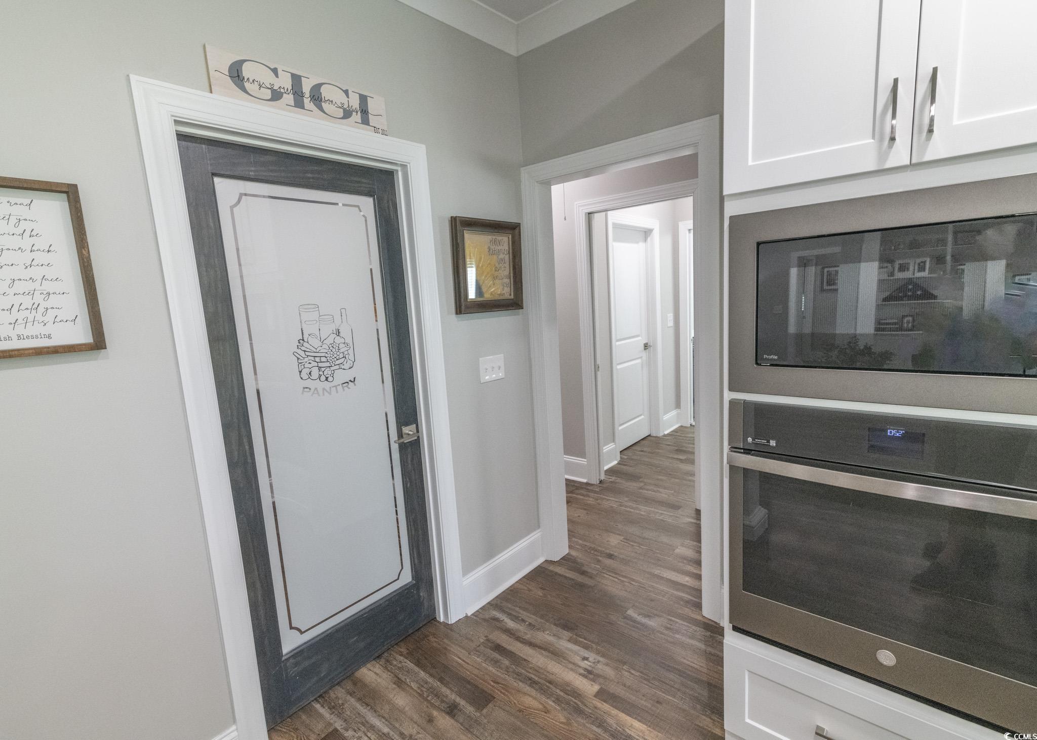 521 Oak Lawn Road Georgetown, SC 29440 - Photo 17 of 40 Foyer entrance featuring dark wood-type flooring and baseboards
