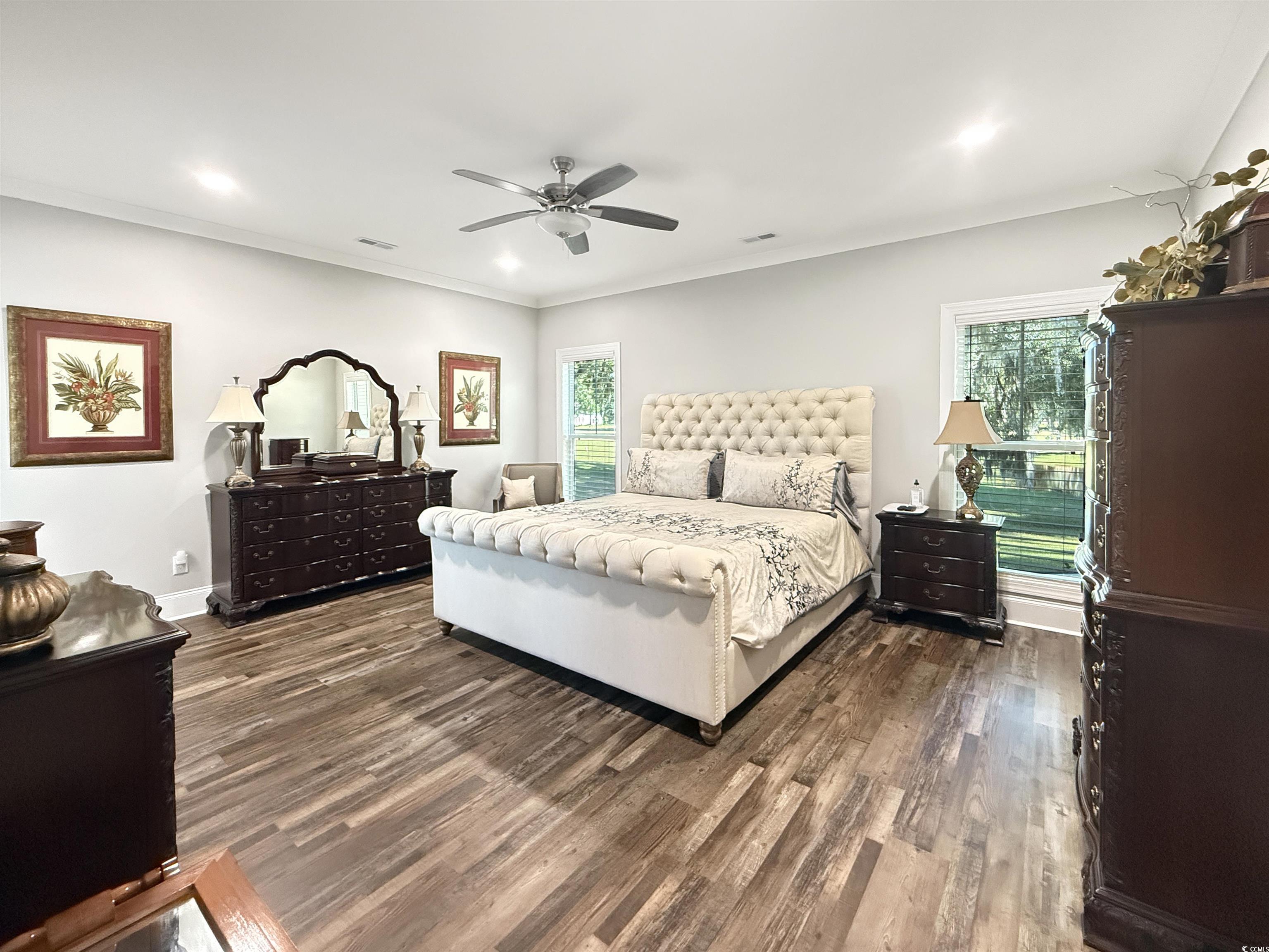 521 Oak Lawn Road Georgetown, SC 29440 - Photo 22 of 40 Bedroom featuring dark wood-type flooring, ceiling fan, crown molding, and recessed lighting