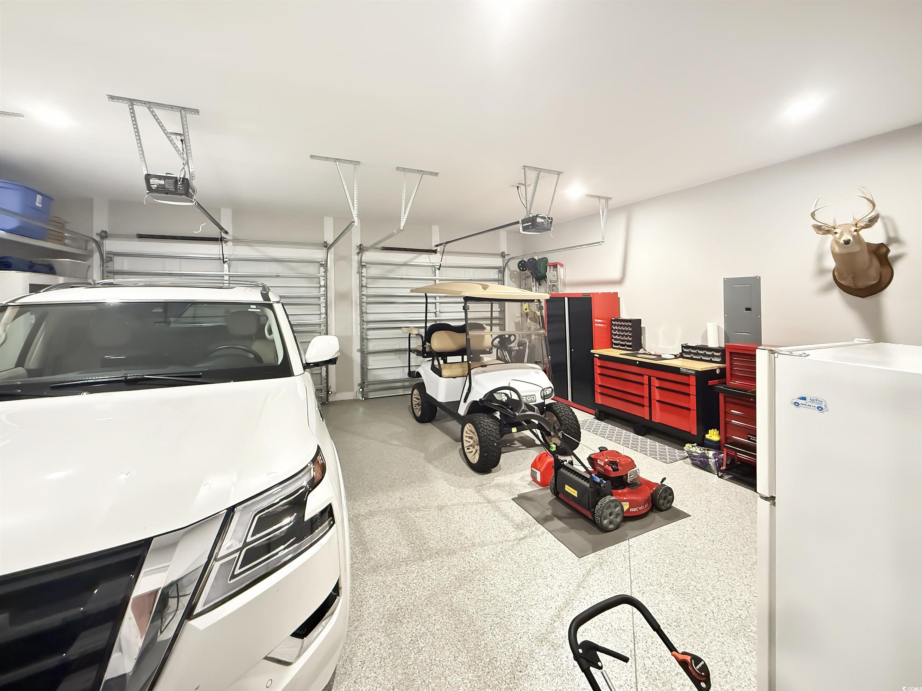 521 Oak Lawn Road Georgetown, SC 29440 - Photo 31 of 40 Garage featuring freestanding refrigerator and electric panel