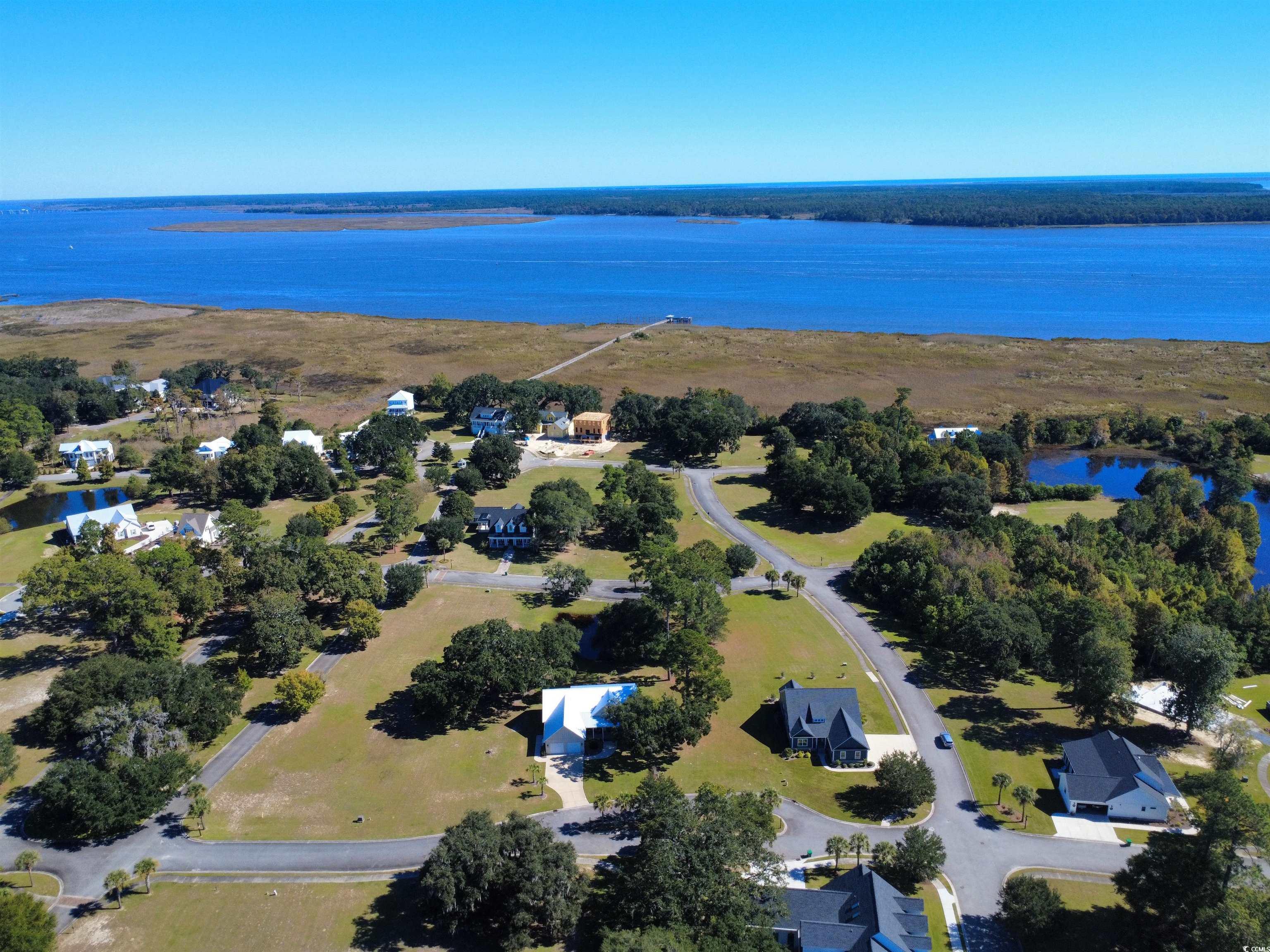 521 Oak Lawn Road Georgetown, SC 29440 - Photo 33 of 40 Aerial view of property and surrounding area featuring a large body of water