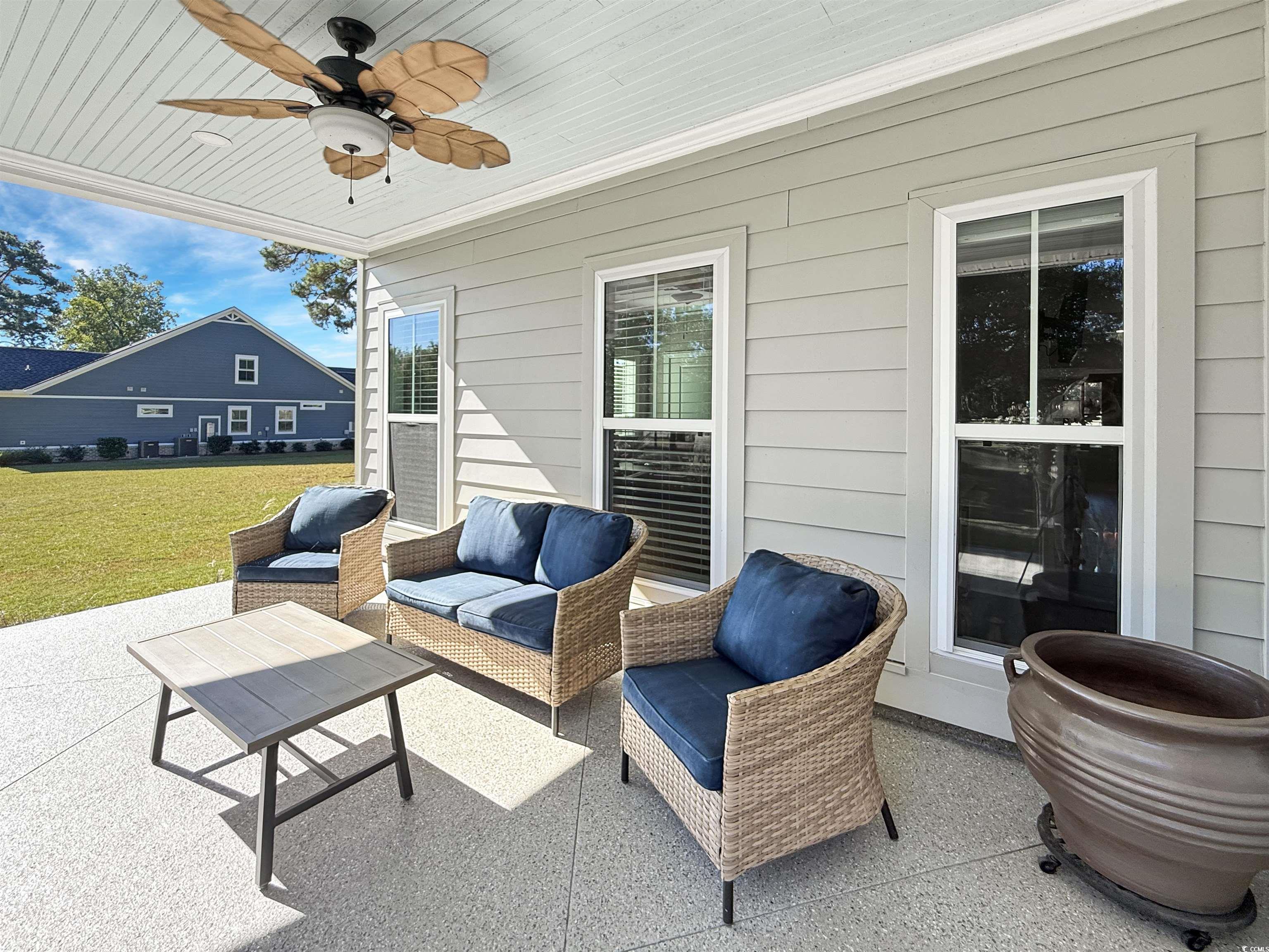 521 Oak Lawn Road Georgetown, SC 29440 - Photo 5 of 40 View of patio / terrace with a ceiling fan and an outdoor hangout area