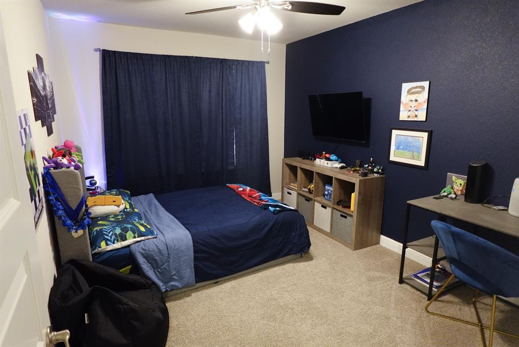 1913 Cookes Lane Cleburne, TX 76033 - Photo 15 of 20 a bedroom with a bed and a flat screen tv