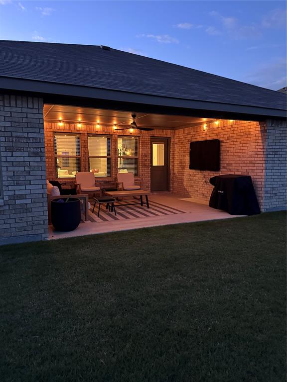 1913 Cookes Lane Cleburne, TX 76033 - Photo 4 of 20 a backyard of a house with table and chairs