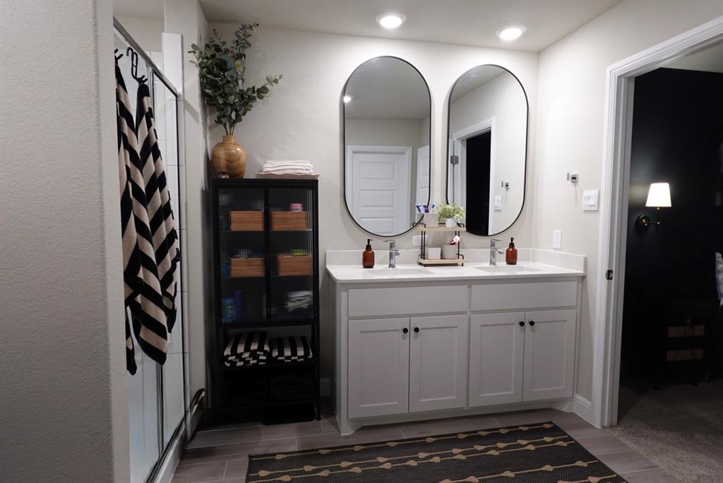 1913 Cookes Lane Cleburne, TX 76033 - Photo 9 of 20 a bathroom with a sink and a mirror