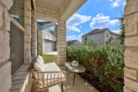 a view of a patio with table and chairs and potted plants
