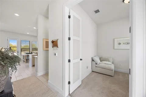 a living room with furniture white walls and white walls
