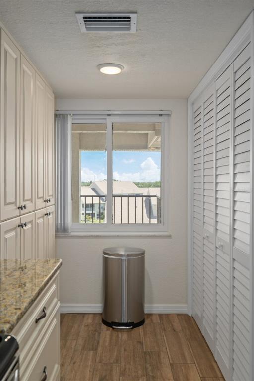 8211 Brent Street, Unit 847 Port Richey, FL 34668 - Photo 15 of 29 a room with a wooden floor and a window