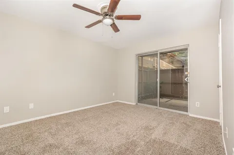 an empty room with fan