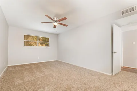 a view of a big room with carpet