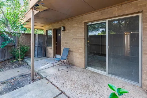 a backyard of a house with seating space