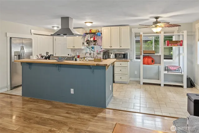 a kitchen with granite countertop a sink and cabinets