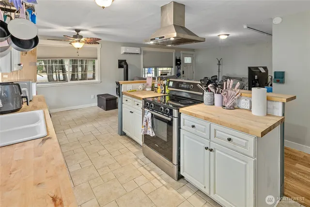 a kitchen with stainless steel appliances granite countertop a stove and a sink