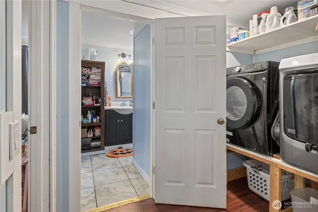 a bathroom with a sink toilet and mirror