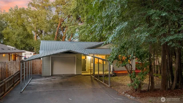 a front view of house with yard outdoor seating and barbeque oven