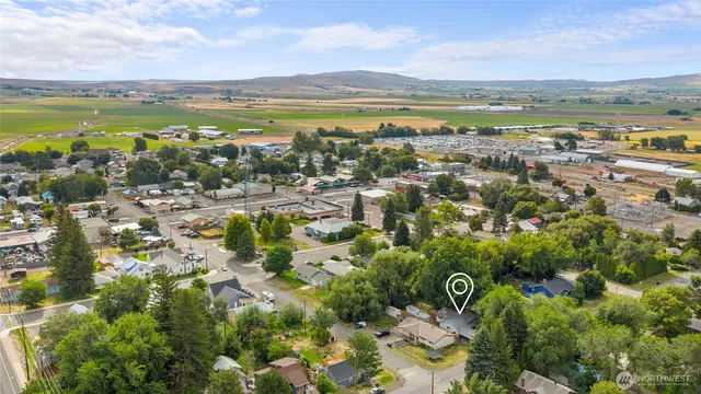 an aerial view of residential building and lake