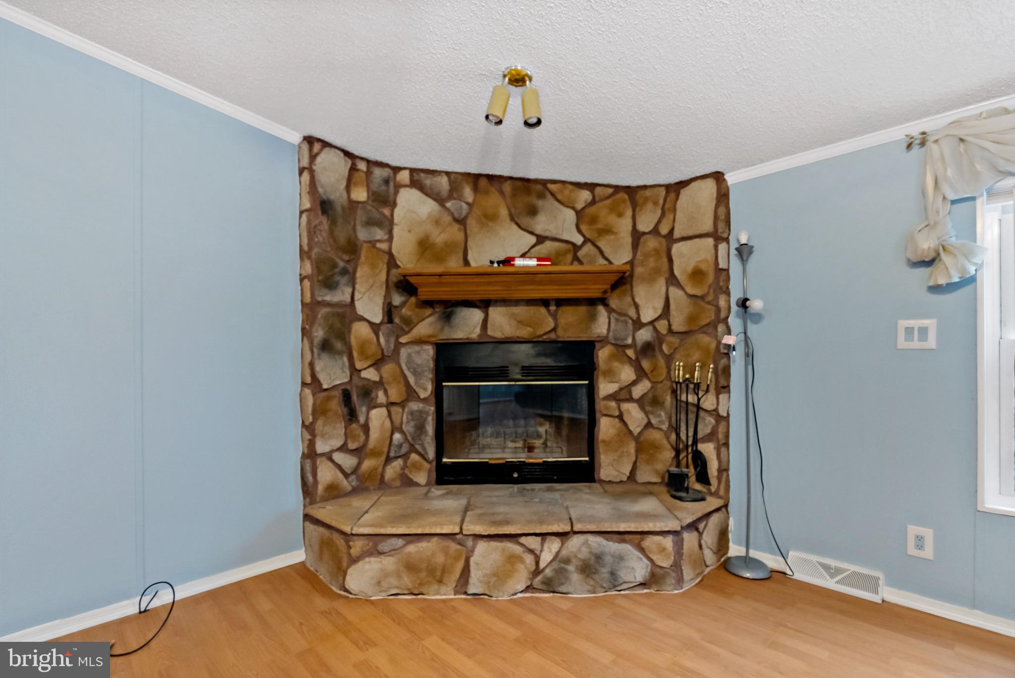 233 Short Road Kearneysville, WV 25430 - Photo 11 of 36 a living room with a fireplace