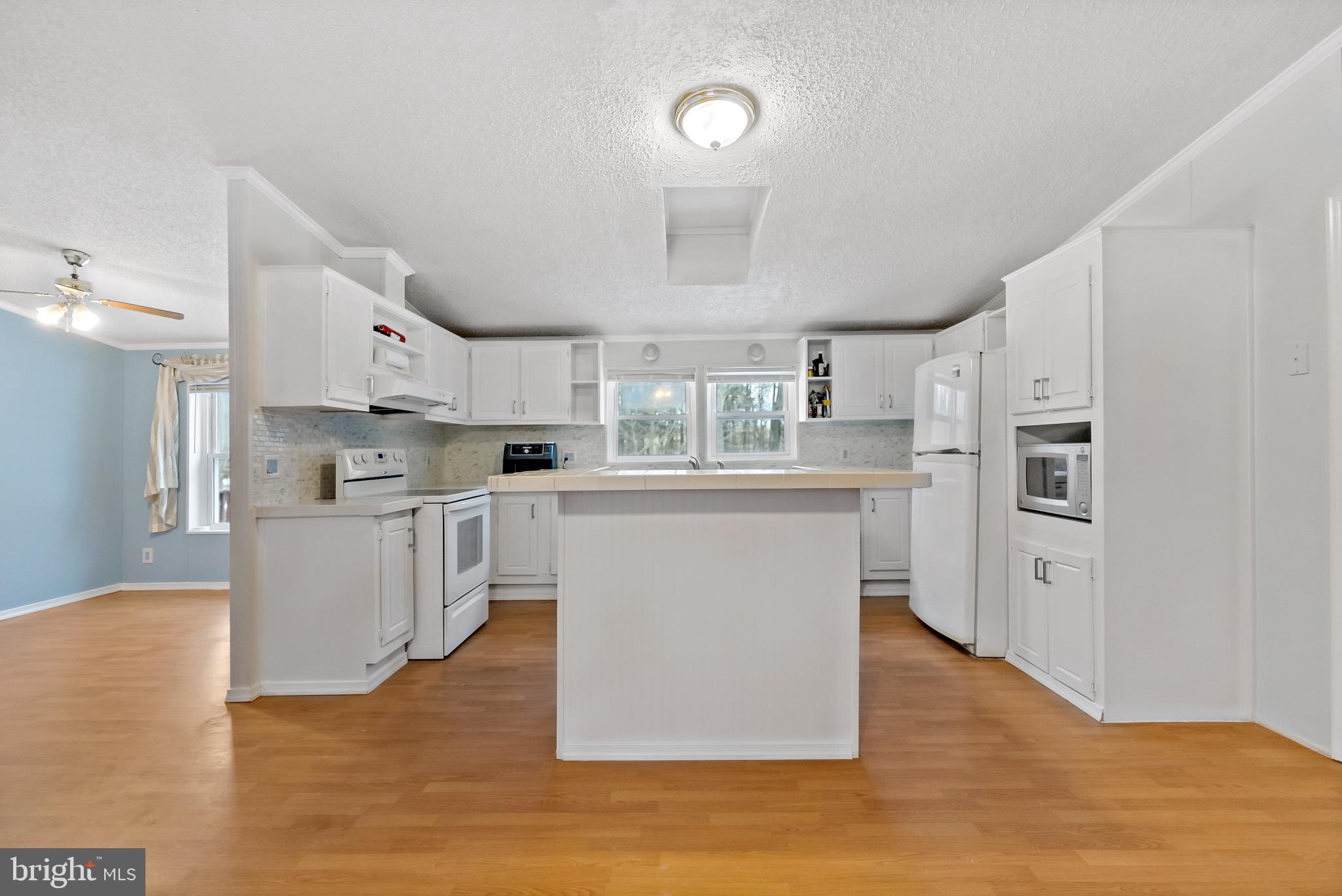 233 Short Road Kearneysville, WV 25430 - Photo 13 of 36 a large kitchen with cabinets and wooden floor