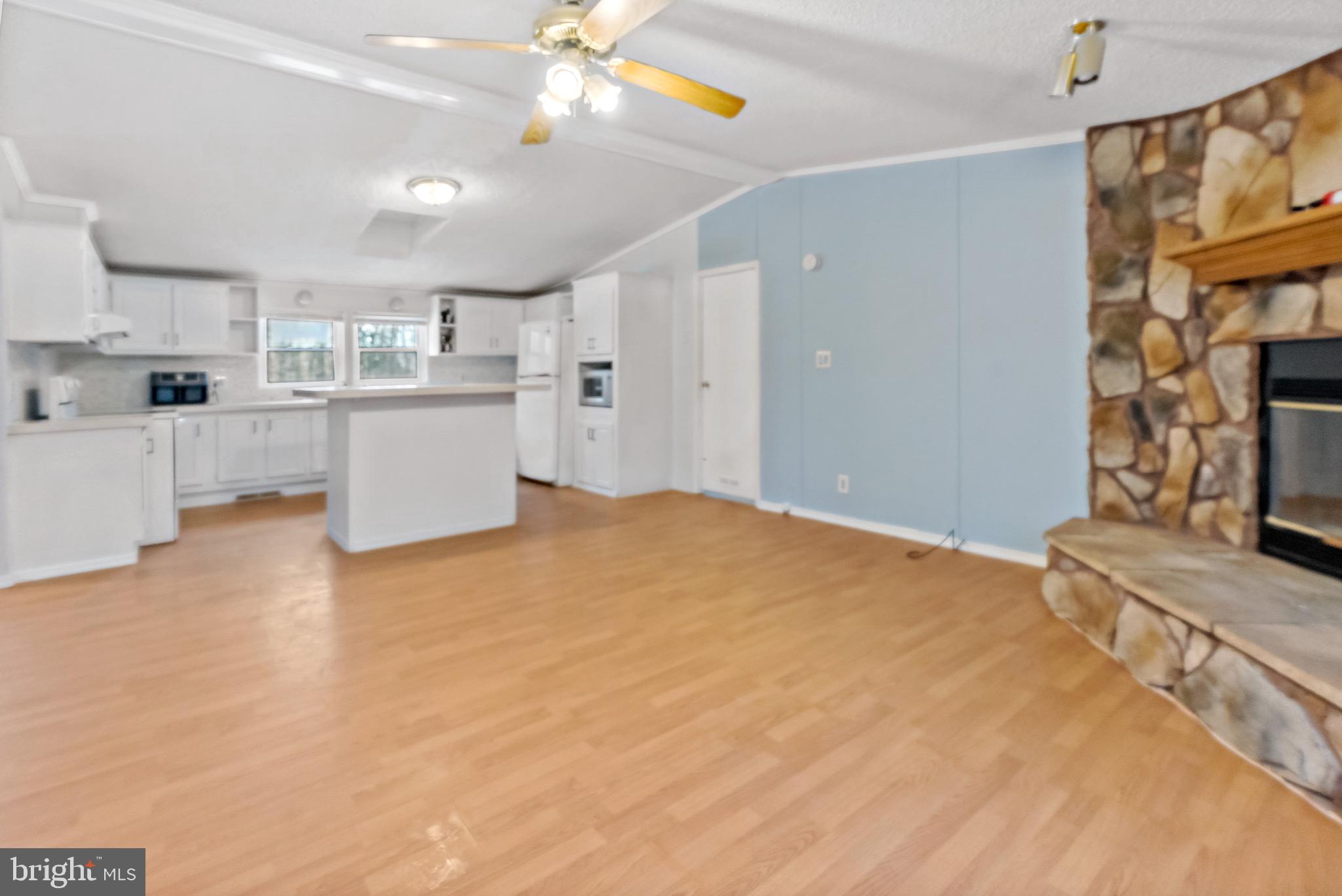 233 Short Road Kearneysville, WV 25430 - Photo 19 of 36 a view of kitchen and hall with wooden floor