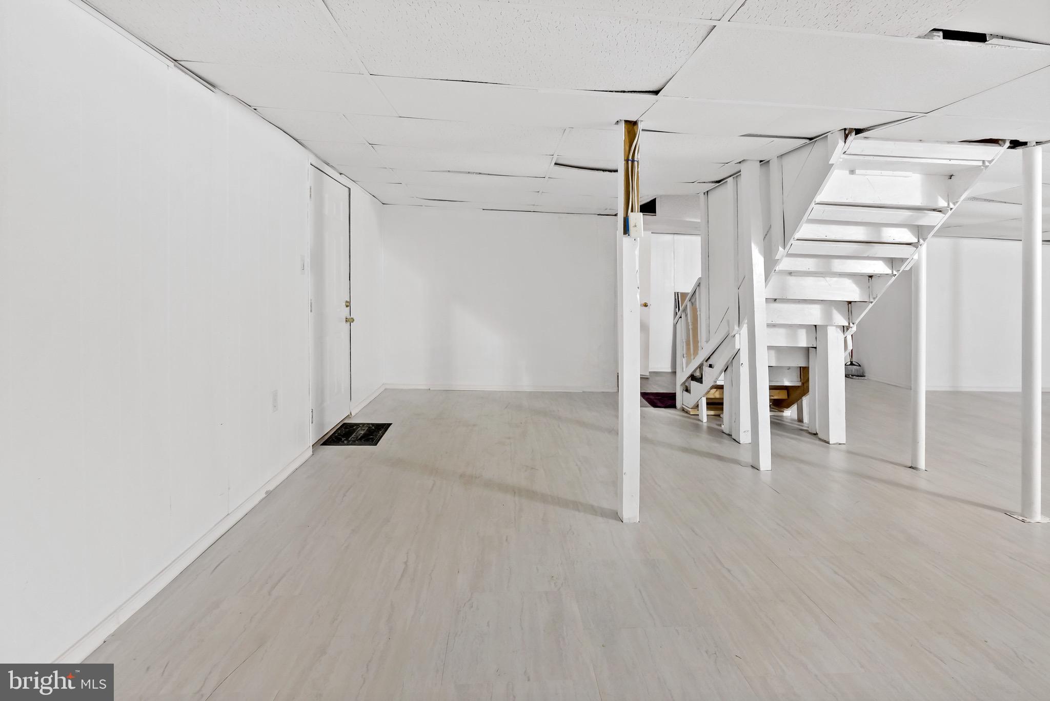 233 Short Road Kearneysville, WV 25430 - Photo 30 of 36 a view of a livingroom with wooden floor and staircase
