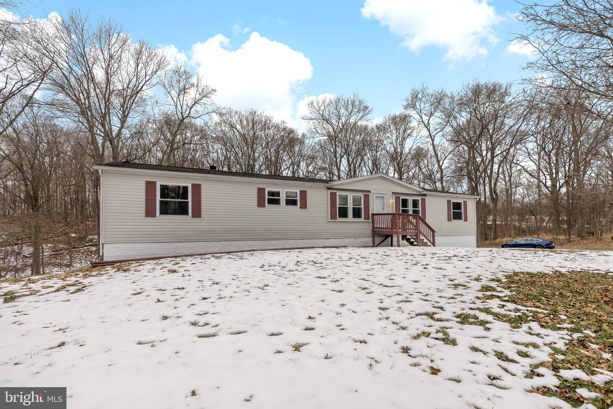 233 Short Road Kearneysville, WV 25430 - Photo 5 of 36 a backyard of a house with large trees