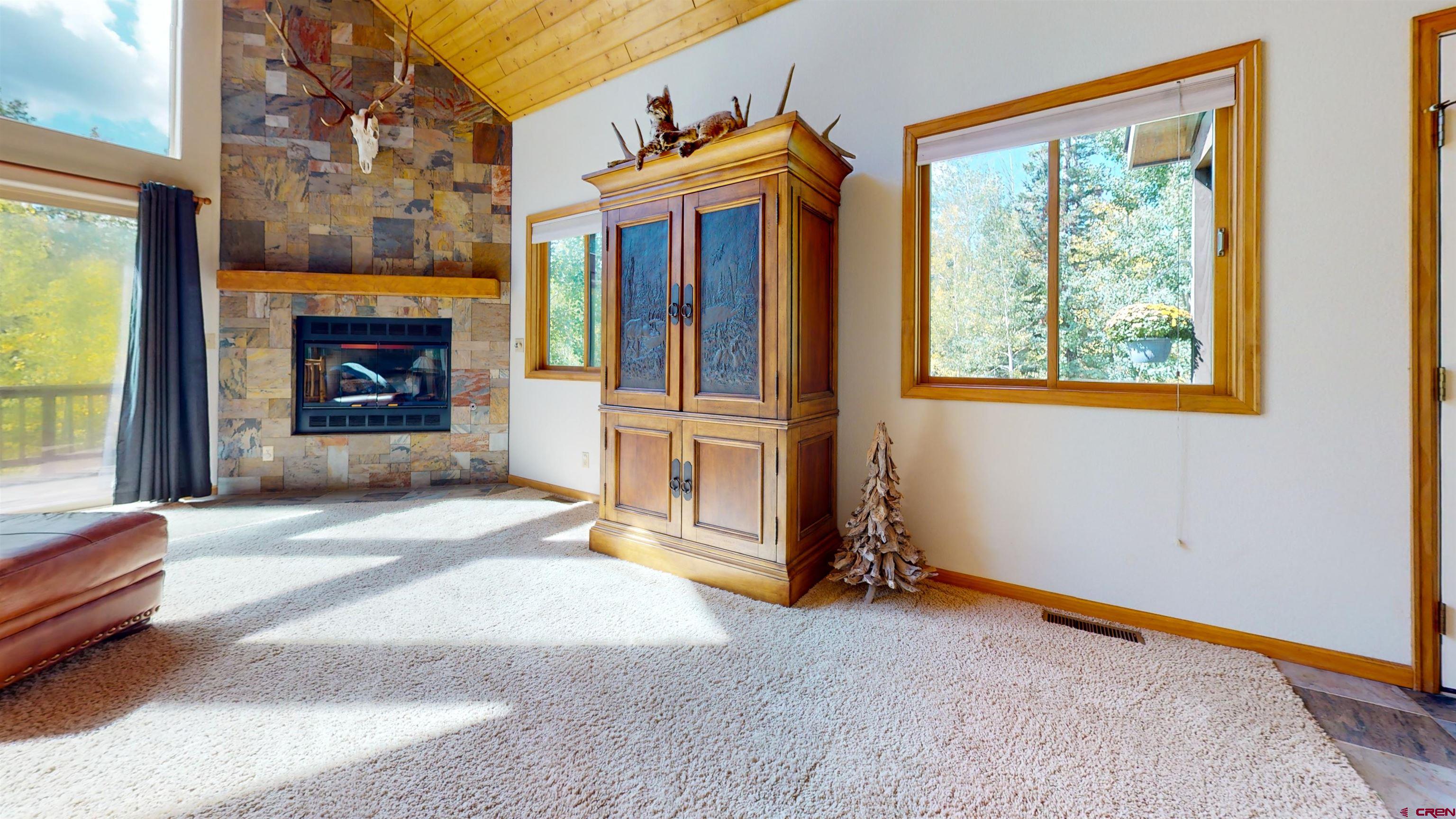 261 Aspen Drive Durango, CO 81301 - Photo 12 of 34 a view of livingroom with fireplace and window