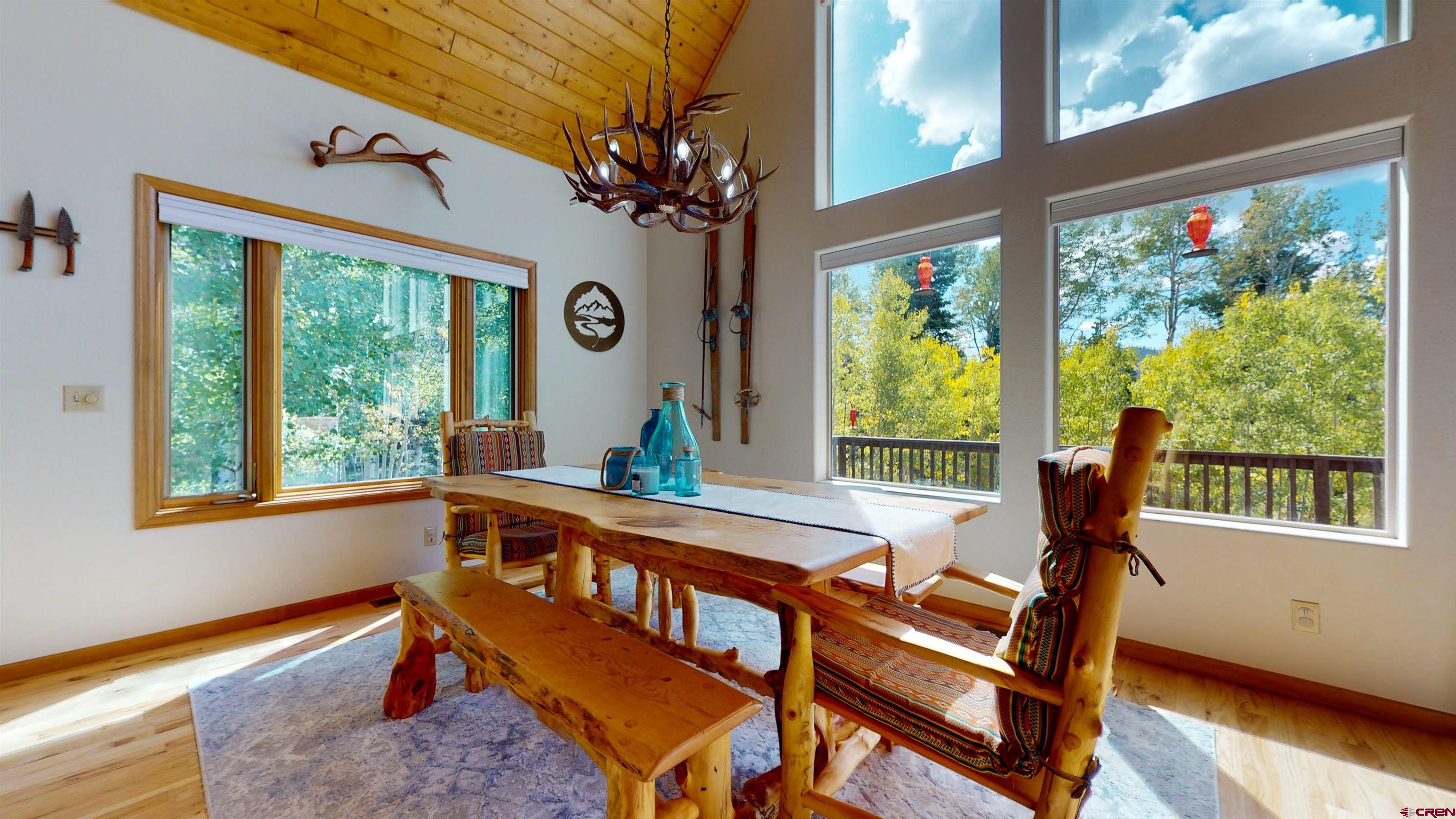 261 Aspen Drive Durango, CO 81301 - Photo 14 of 34 a view of a dining room with furniture window and outside view