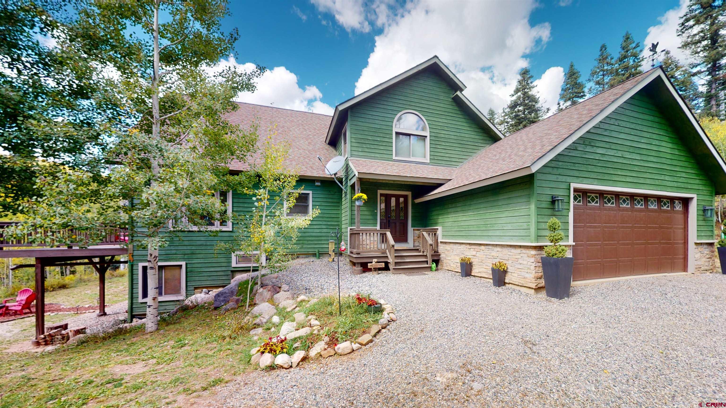 261 Aspen Drive Durango, CO 81301 - Photo 3 of 34 a view of a house with backyard outdoor seating and hardwood