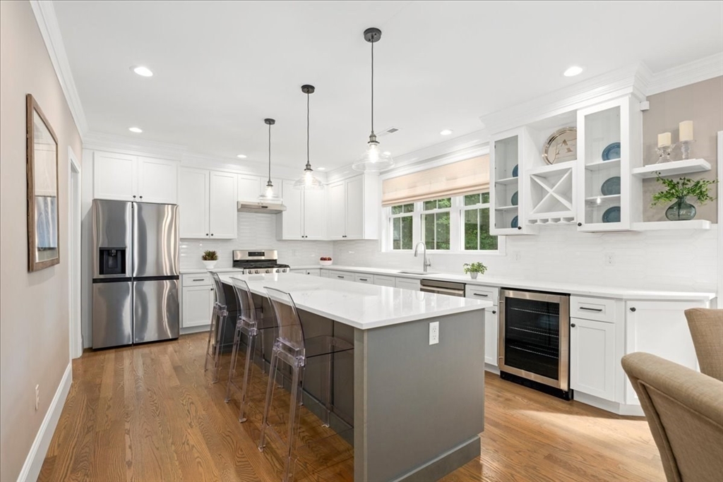 11 Waring Road Natick, MA 01760 - Photo 12 of 41 a kitchen with a sink a counter top space stainless steel appliances and cabinets