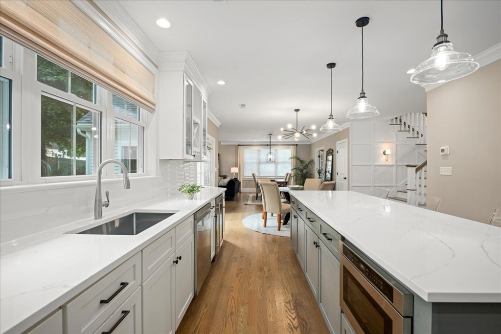 11 Waring Road Natick, MA 01760 - Photo 14 of 41 a large kitchen with kitchen island a large island in it