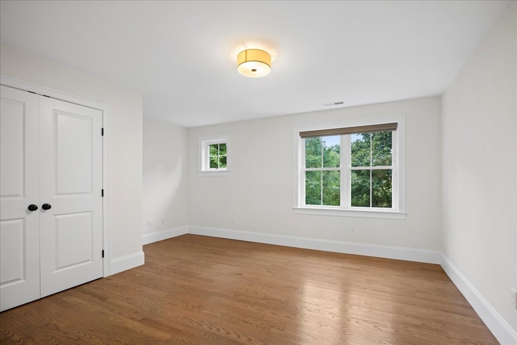11 Waring Road Natick, MA 01760 - Photo 30 of 41 wooden floor in an empty room with a window