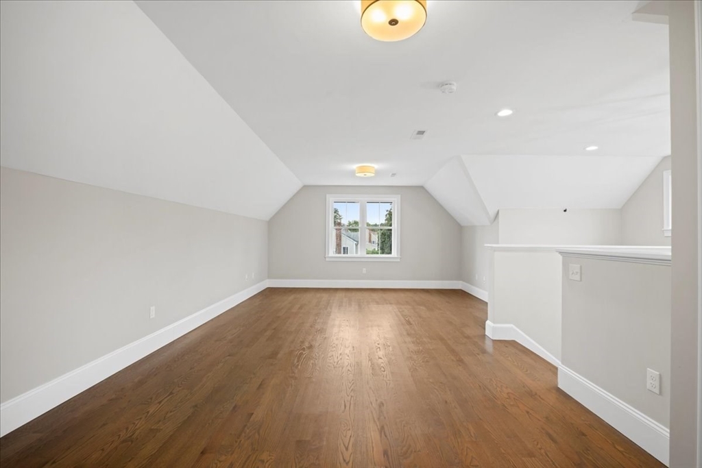 11 Waring Road Natick, MA 01760 - Photo 33 of 41 an empty room with wooden floor and windows
