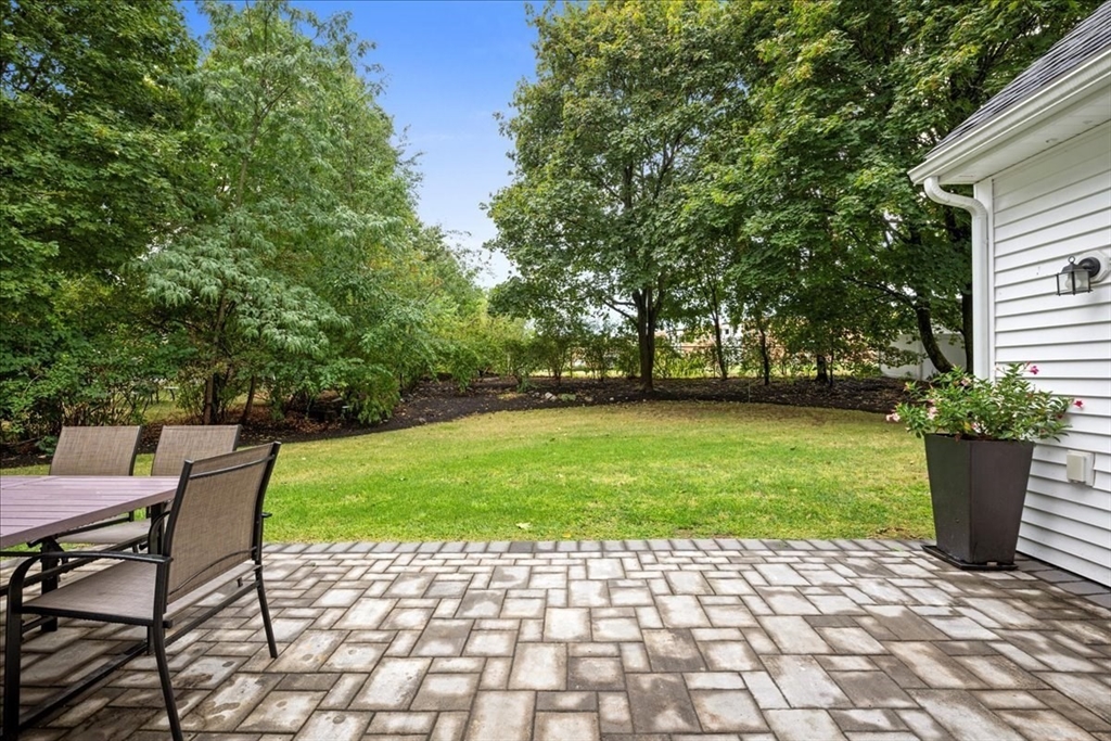 11 Waring Road Natick, MA 01760 - Photo 36 of 41 a view of a chairs and table in the backyard