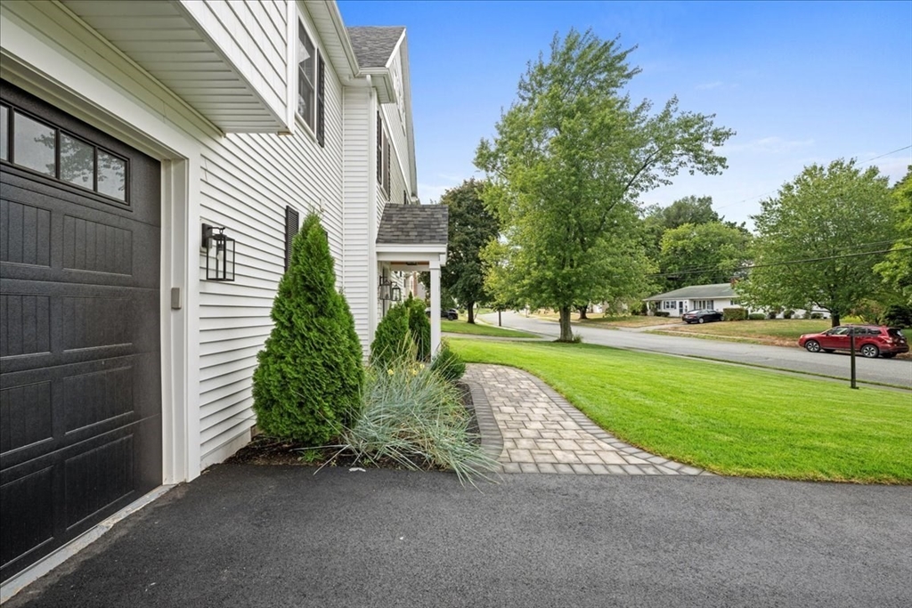 11 Waring Road Natick, MA 01760 - Photo 39 of 41 a view of a garden with an outdoor space