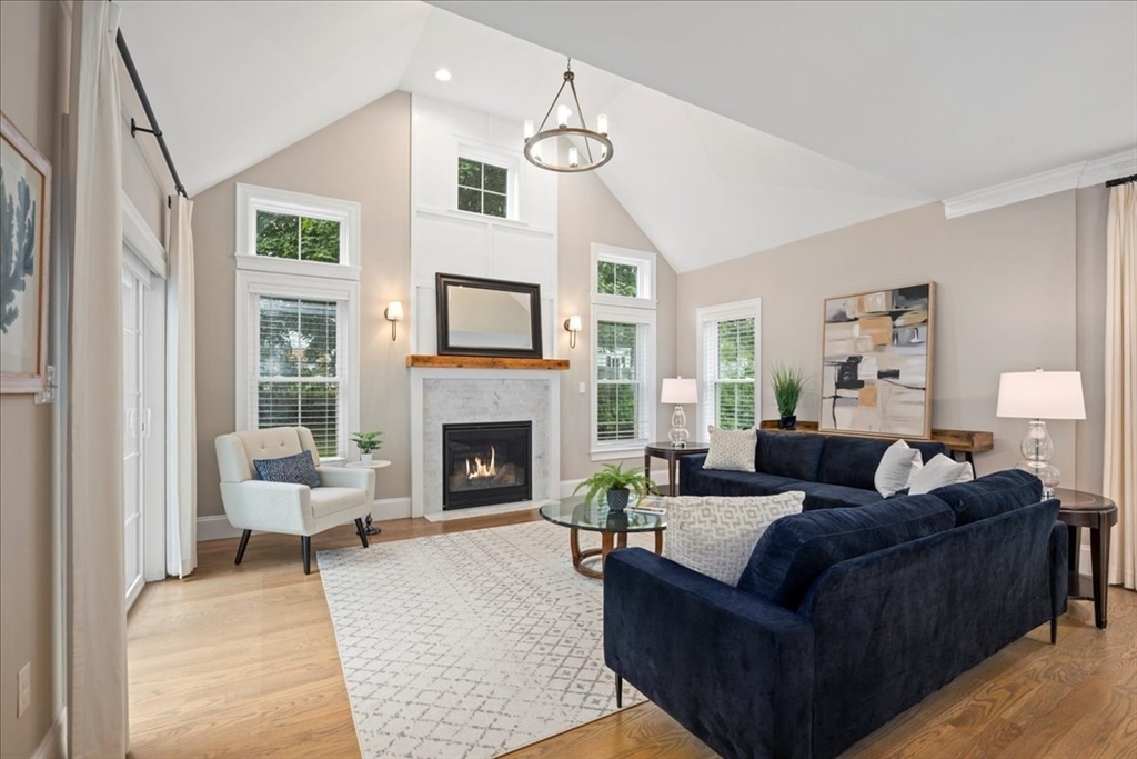 11 Waring Road Natick, MA 01760 - Photo 4 of 41 a living room with furniture a fireplace and a large window