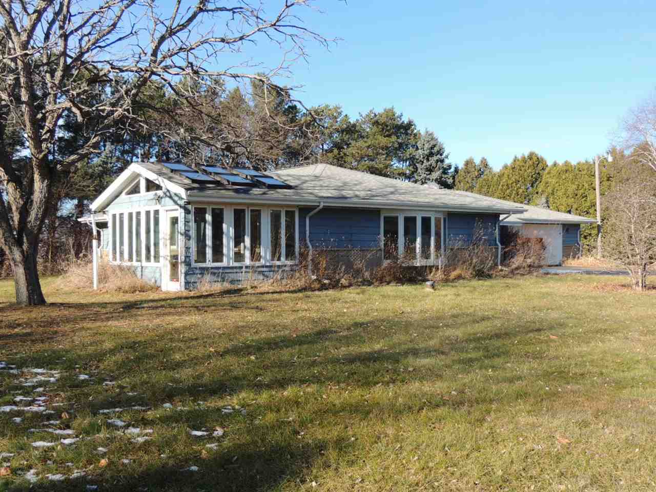 8344 South Schroeder Road Clinton, WI 53525 - Photo 1 of 25 a front view of a house with a garden
