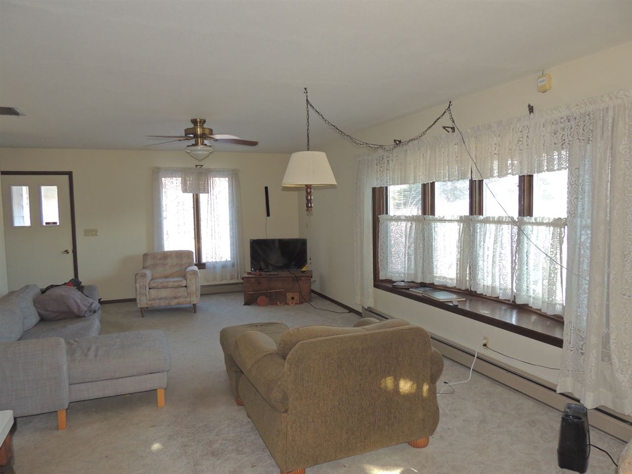 8344 South Schroeder Road Clinton, WI 53525 - Photo 13 of 25 a living room with furniture and a large window