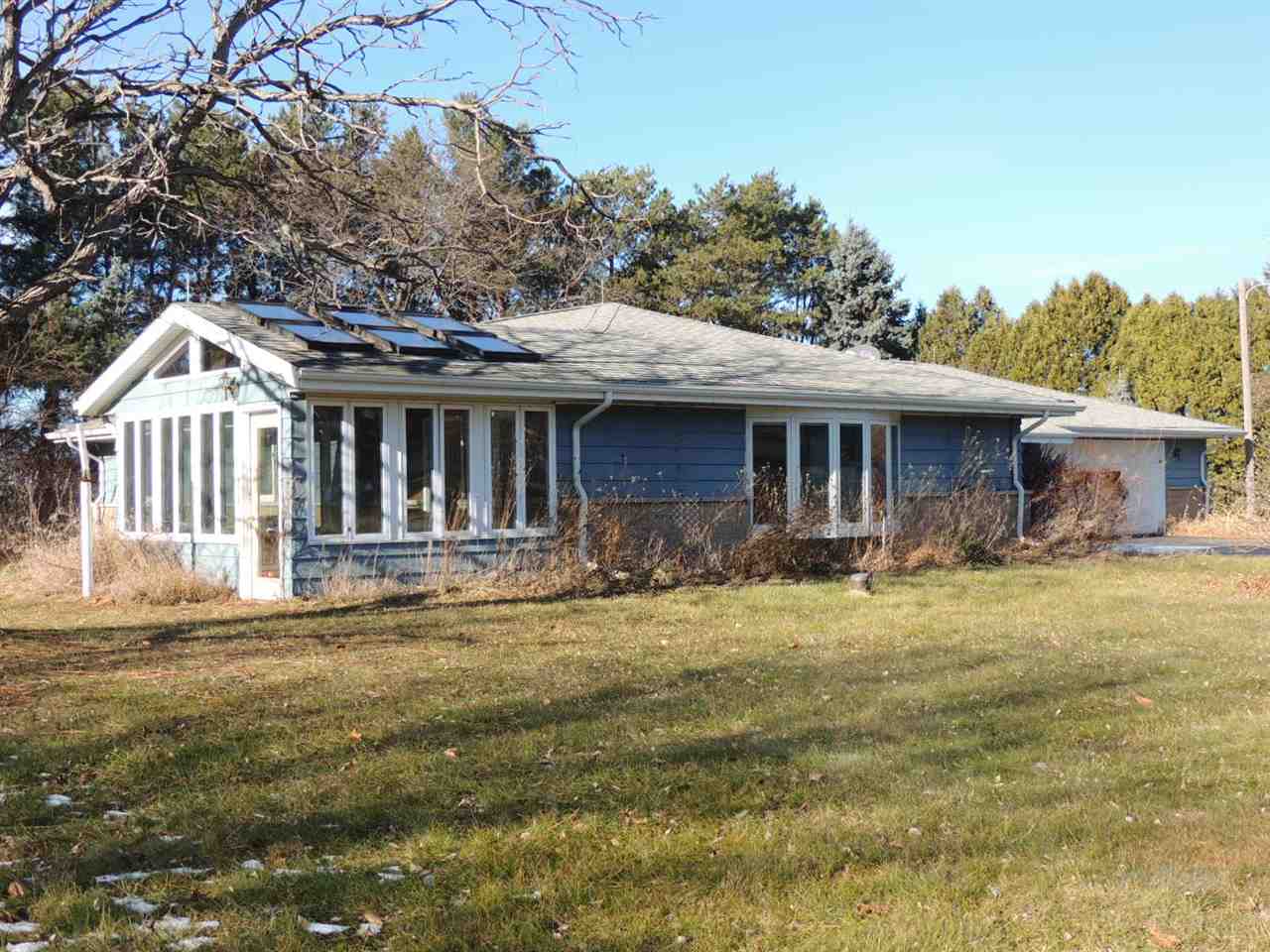 8344 South Schroeder Road Clinton, WI 53525 - Photo 14 of 25 a front view of a house with a yard