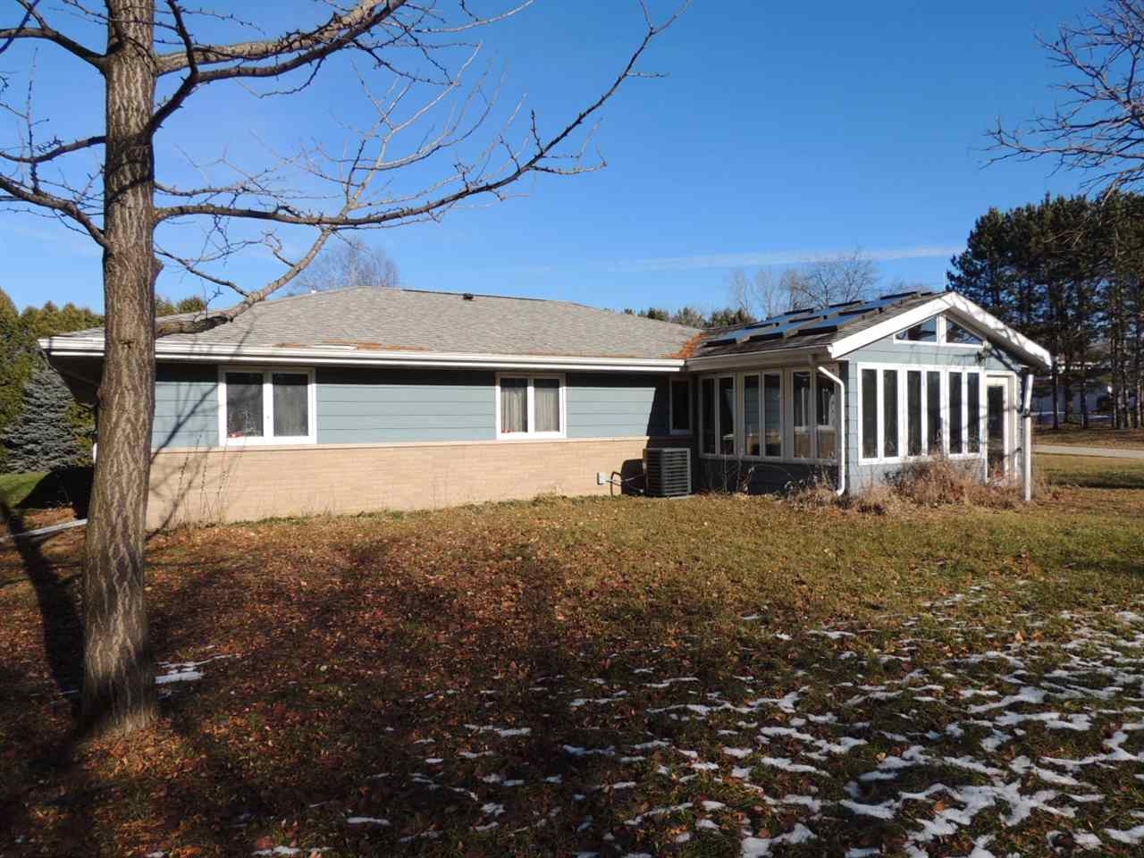 8344 South Schroeder Road Clinton, WI 53525 - Photo 22 of 25 a view of a house with a yard