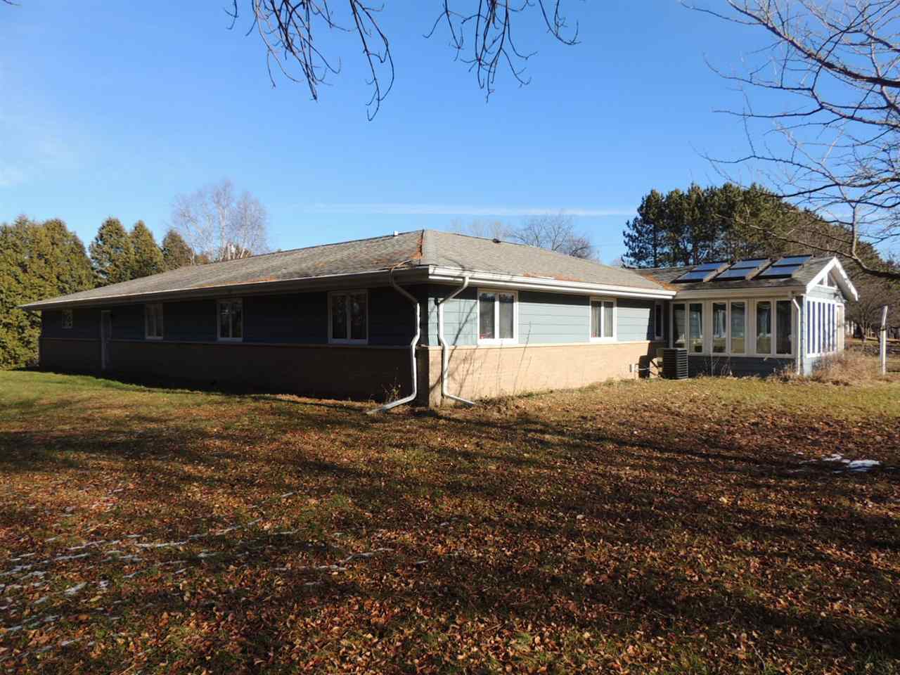 8344 South Schroeder Road Clinton, WI 53525 - Photo 23 of 25 a front view of a house with a garden