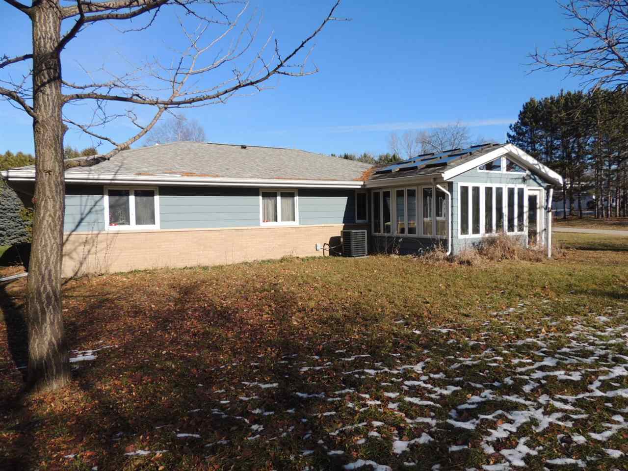 8344 South Schroeder Road Clinton, WI 53525 - Photo 5 of 25 a front view of a house with a yard