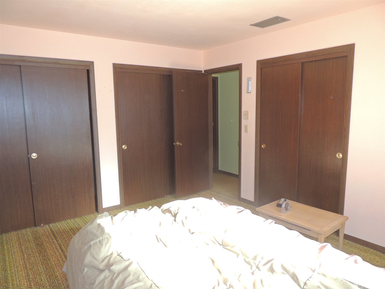 8344 South Schroeder Road Clinton, WI 53525 - Photo 6 of 25 a bedroom with a bed and a mirror