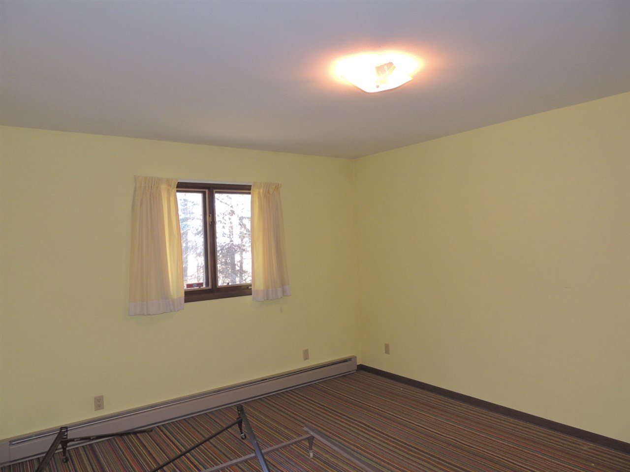 8344 South Schroeder Road Clinton, WI 53525 - Photo 8 of 25 a view of empty room with wooden floor and fan
