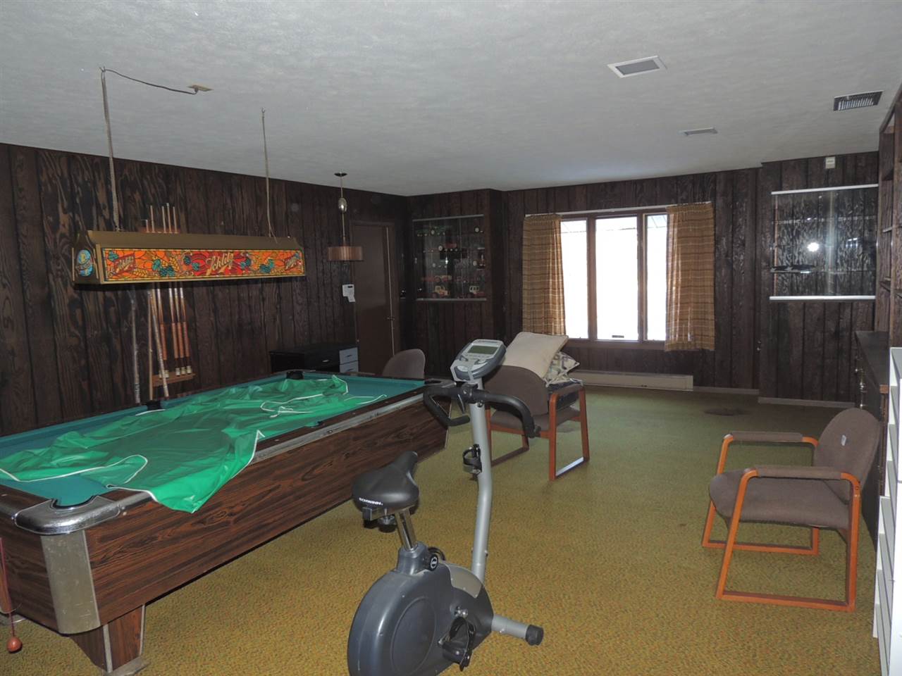 8344 South Schroeder Road Clinton, WI 53525 - Photo 10 of 25 a living room with furniture a window and a table