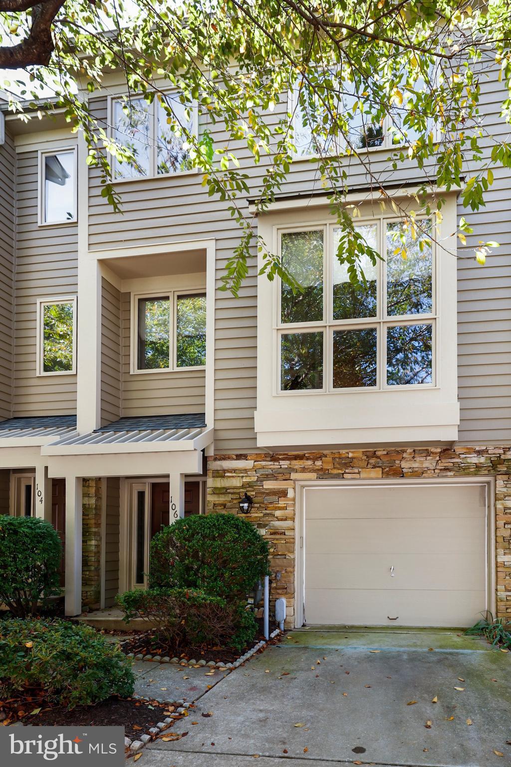 106 Lancefield Road Baltimore, MD 21209 - Photo 2 of 37 a front view of a house with a yard and garage