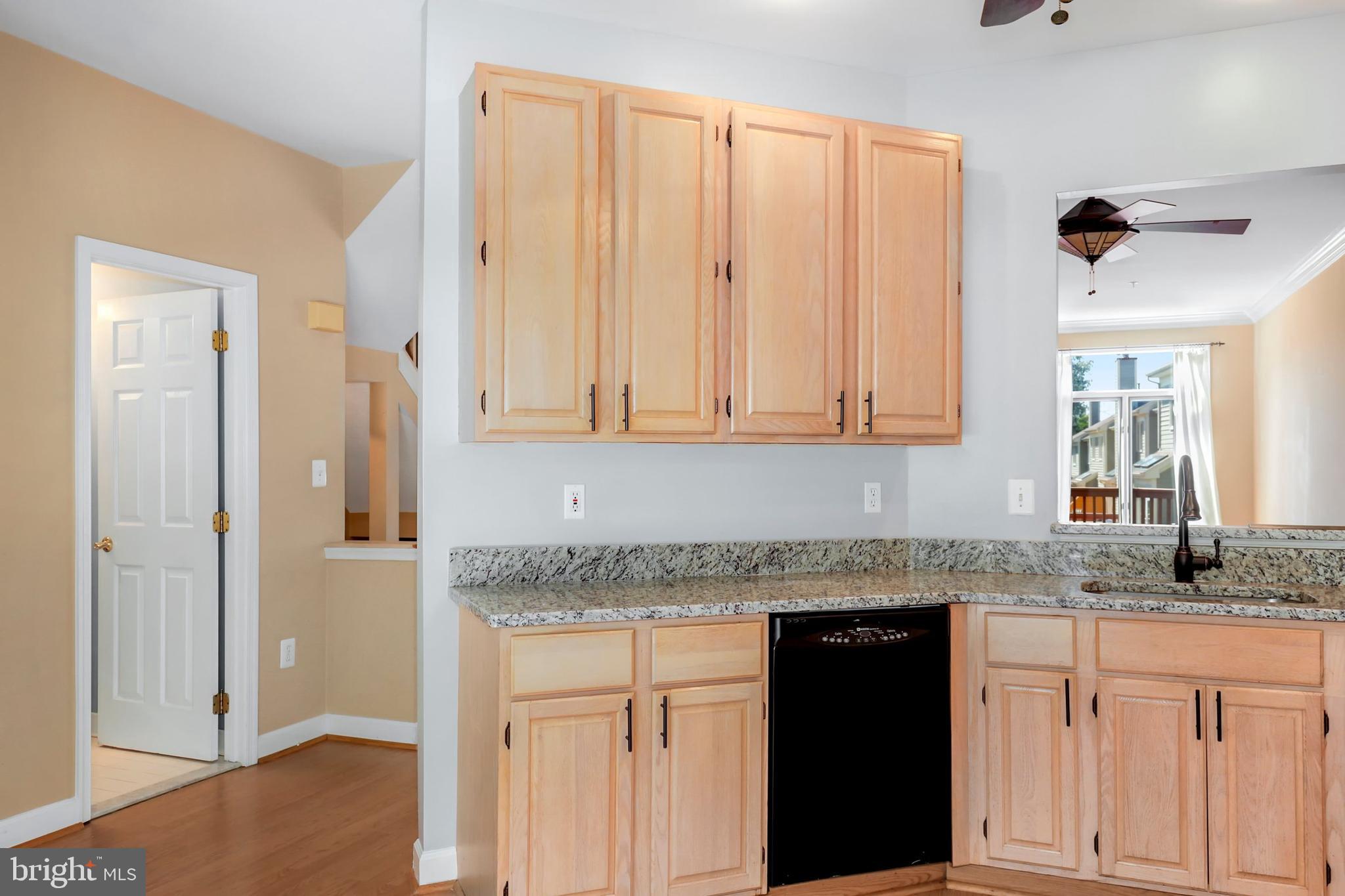 106 Lancefield Road Baltimore, MD 21209 - Photo 11 of 37 a white kitchen with granite countertop a sink