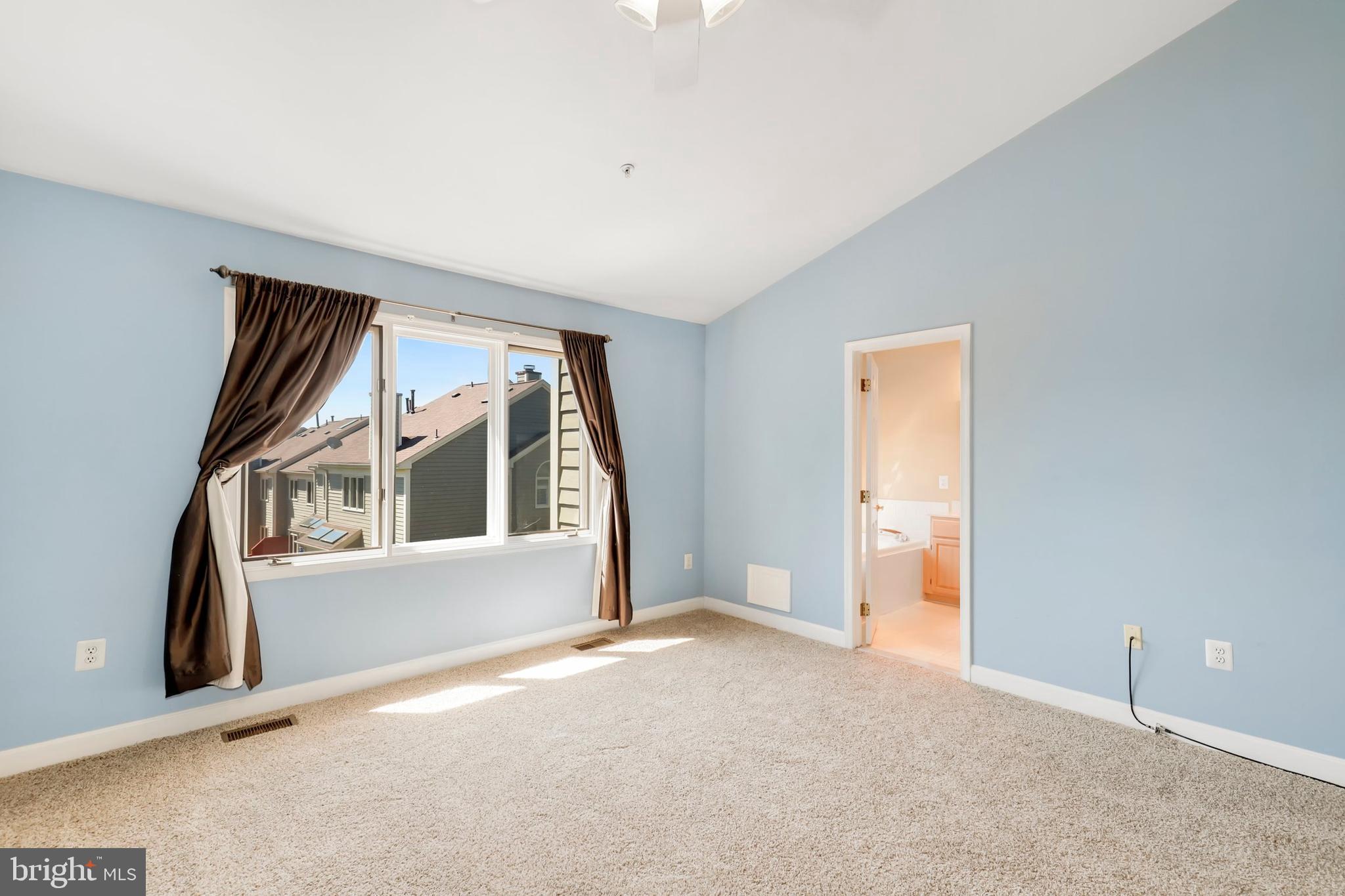 106 Lancefield Road Baltimore, MD 21209 - Photo 18 of 37 an empty room with windows