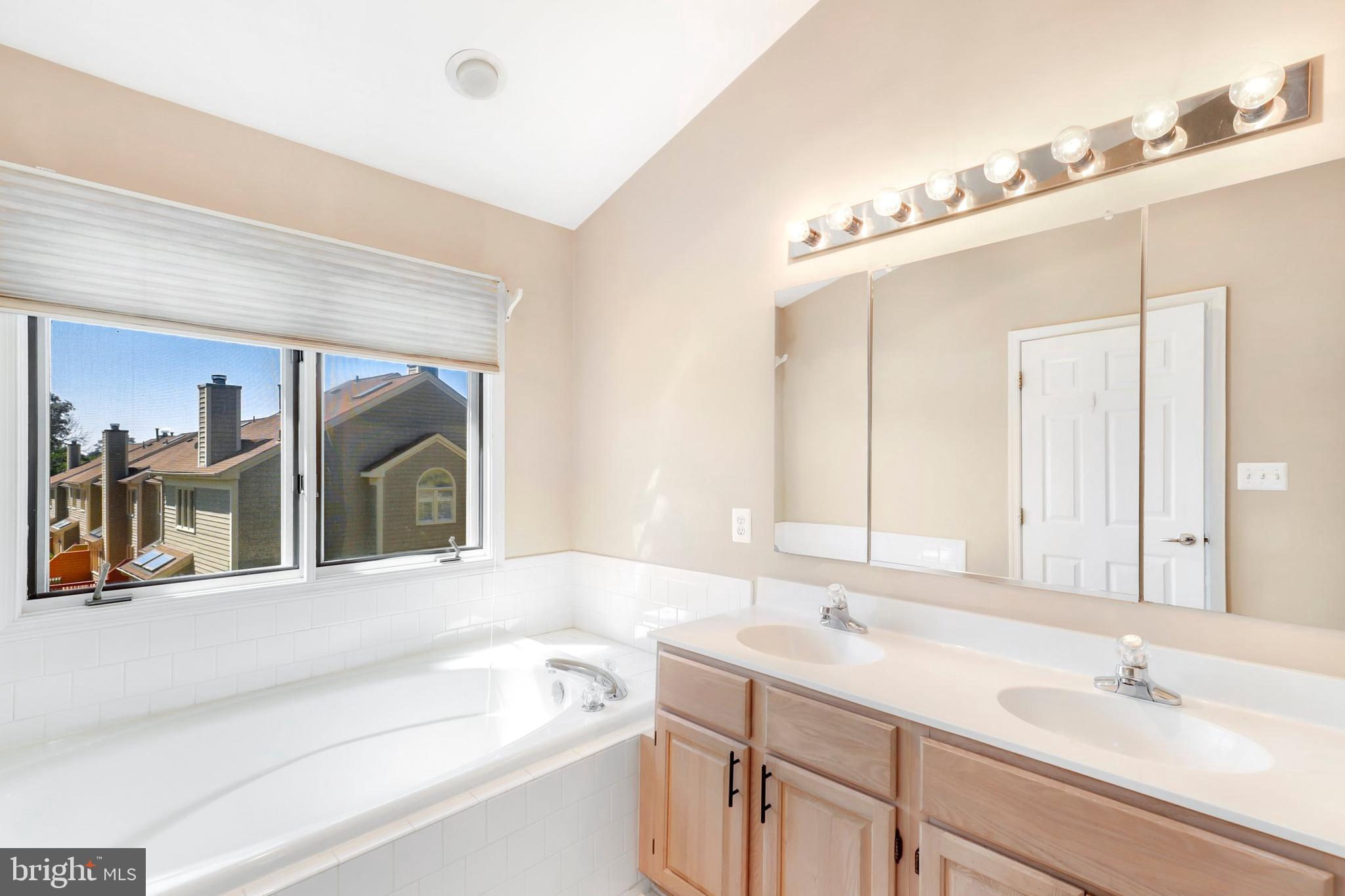 106 Lancefield Road Baltimore, MD 21209 - Photo 22 of 37 a bathroom with a sink and a mirror