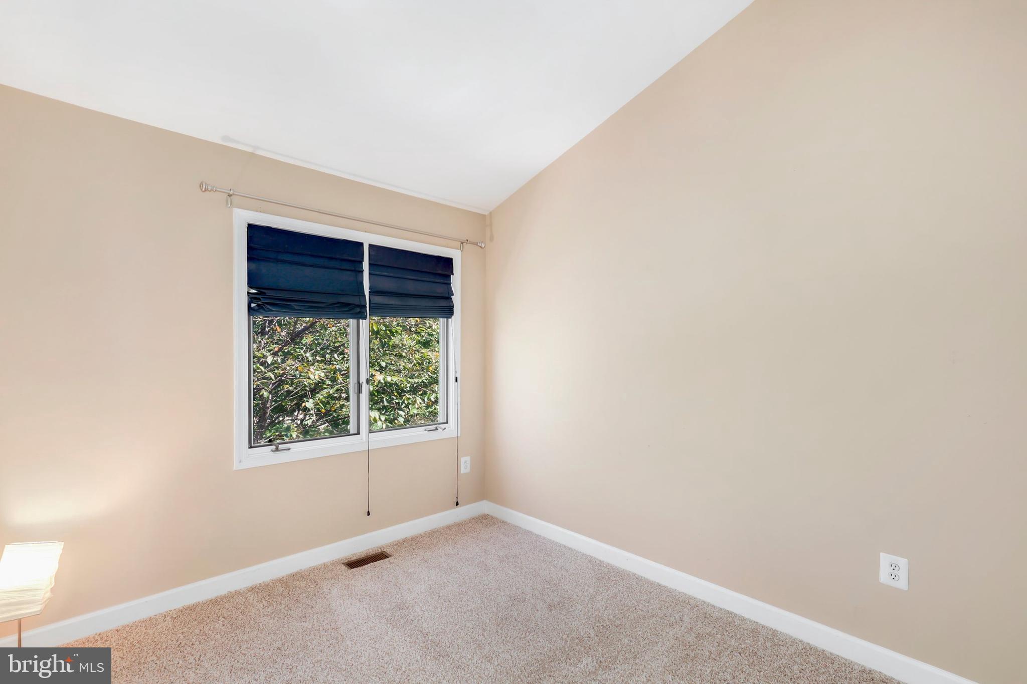 106 Lancefield Road Baltimore, MD 21209 - Photo 23 of 37 an empty room with windows