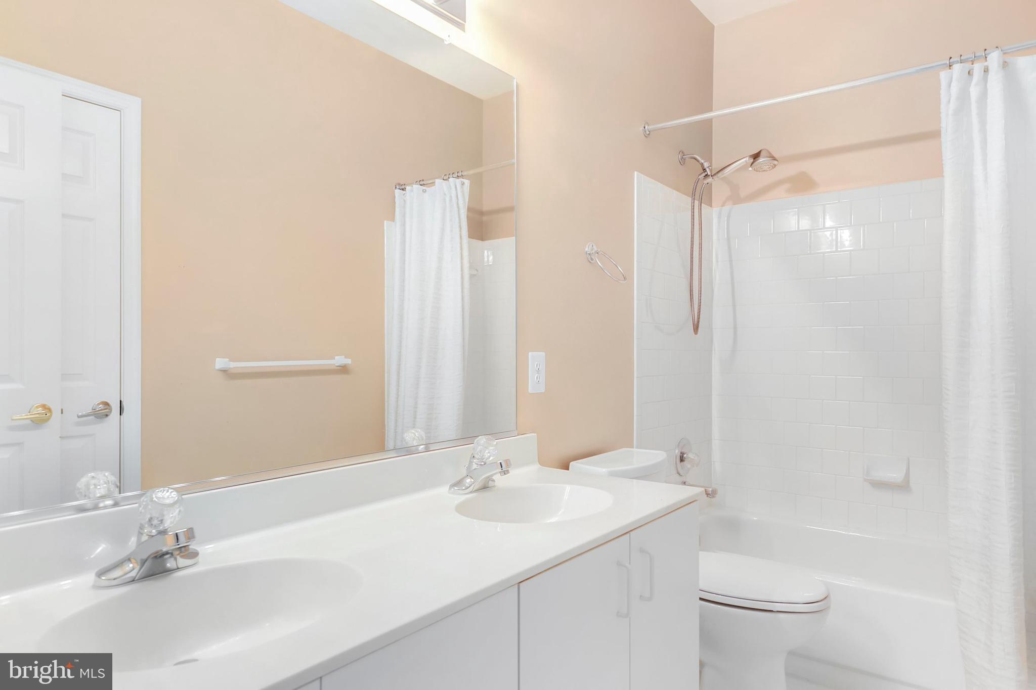 106 Lancefield Road Baltimore, MD 21209 - Photo 27 of 37 a bathroom with a sink a toilet and shower