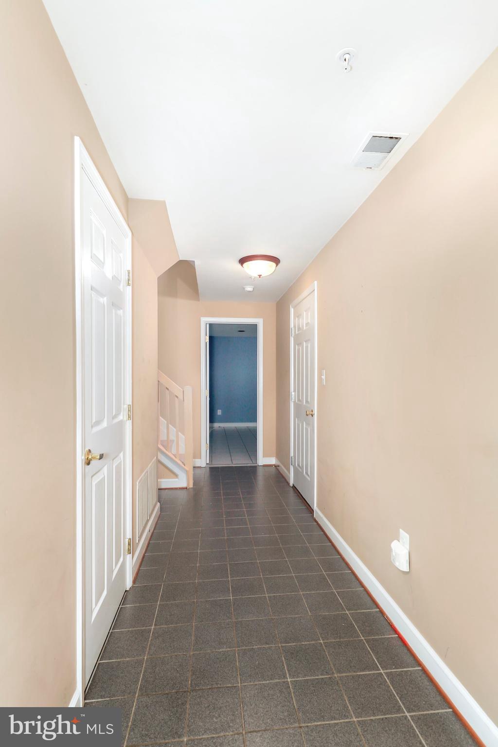 106 Lancefield Road Baltimore, MD 21209 - Photo 32 of 37 a view of a hallway with windows